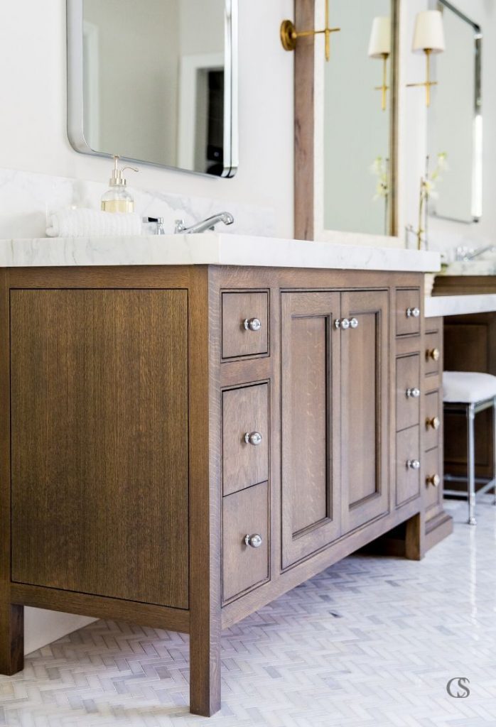 See the way the end piece of this custom cabinet design for the bathroom mimics the lines on the front? It's the details that make custom cabinetry so unique and special.