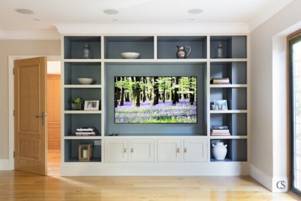 Wanting to relax in front of the tv doesn't mean the entire space has to feel super casual. Creating a custom entertainment center means leaving space for all the right elements to make your home worthy of beautiful display.