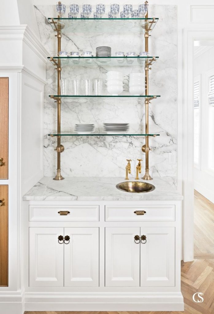 Glass and brass combine here to make a great bar space in this custom kitchen design.