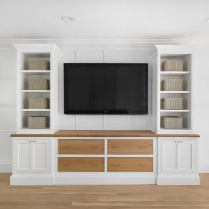 Open shelving is the perfect way to bring lightness to a big entertainment center, but it doesn't mean everything has to be on display. For more of our best entertainment center ideas, check out ChristopherScottCabinetry.com!