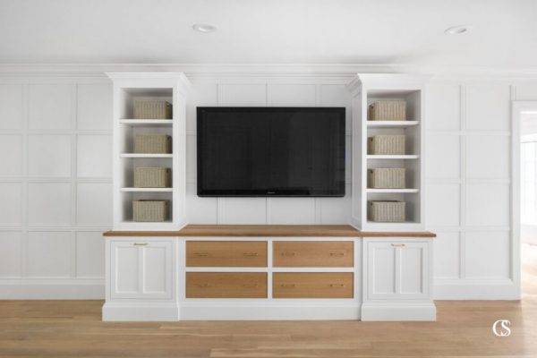 Open shelving is the perfect way to bring lightness to a big entertainment center, but it doesn't mean everything has to be on display. For more of our best entertainment center ideas, check out ChristopherScottCabinetry.com!