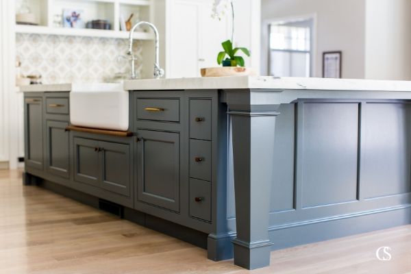 Blue paint in a kitchen? Yeah, we're here for it. Sometimes the best island ideas for a kitchen mean a beautiful pop of color to center the room around.