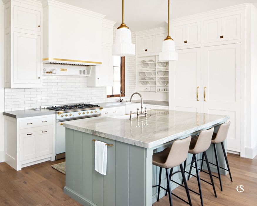 Work with your layout when designing custom cabinets for your kitchen—asymmetry can be a source of unique beauty in a room!