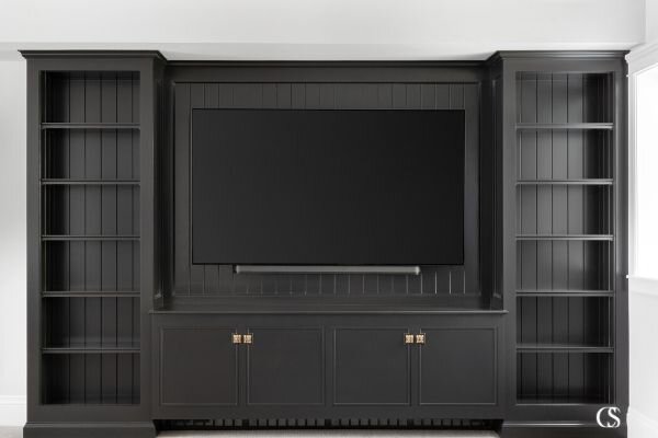 Have you ever considered black cabinets? The dark color sets the stage for the perfect custom entertainment center, letting all that entertainment speak volumes!