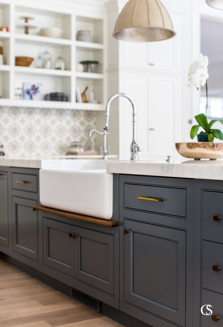 Blue custom cabinets in the kitchen don't have to be bright or overwhelming. I love the subtle, almost smokey blue of this kitchen island and how it grounds a mostly white kitchen.