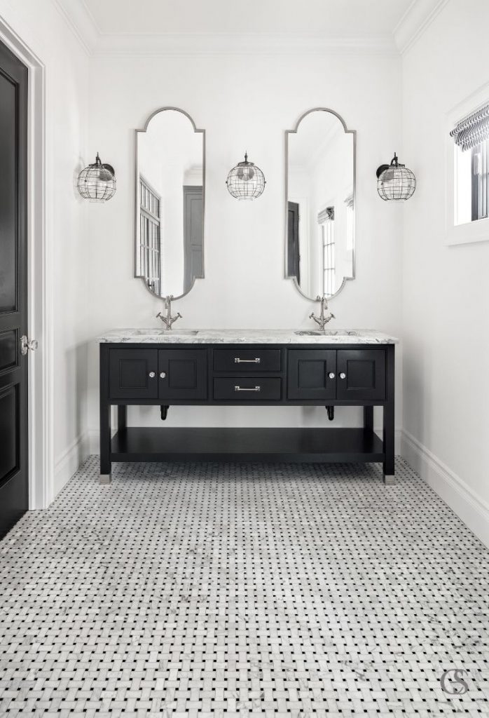 Don't sell your guest bathroom short! Even smaller spaces can accommodate custom two sink bathroom designs.