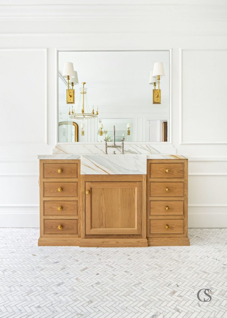 The many design ideas for this cabinet included a marble front sink extending from the countertop to really make a statement.