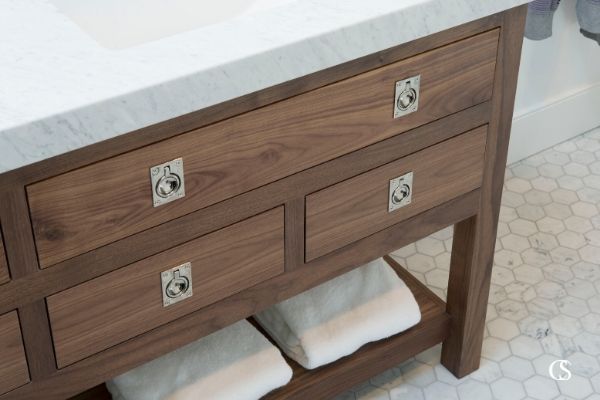 Slab style drawer fronts anyone? This unique custom bathroom cabinet pulls off a look completely different than most bathroom vanities—that's what working with professional cabinet designers will get you.