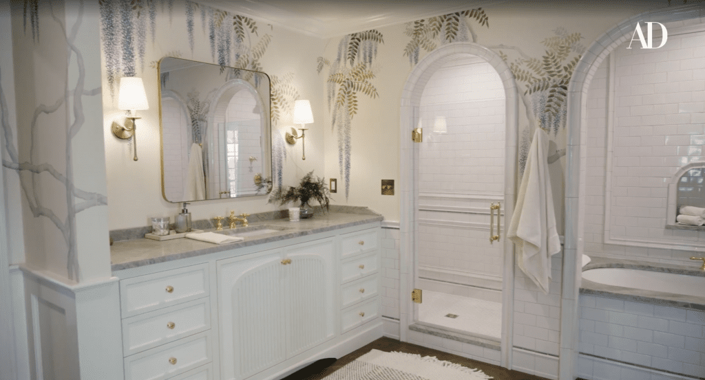 A large portion of the room’s visual design centers around the three archways built around the shower, tub, and toilet areas—which we were able to perfectly echo in the design of the custom bathroom vanities we created