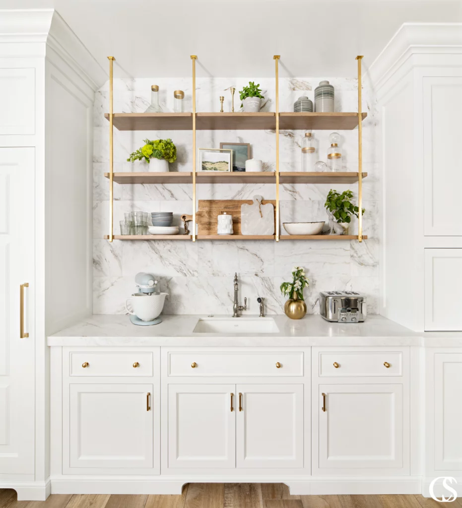 Learn how to match paint and hardware for your cabinetry in this helpful post by Christopher Scott Cabinetry. Explore which paint colors go best with brass, nickel, matte black knobs, pulls, and more!