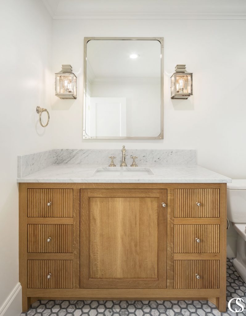 The vertical pattern on the drawers of this custom bathroom cabinet design is absolutely everything. Can you imagine it without now that you've seen it??