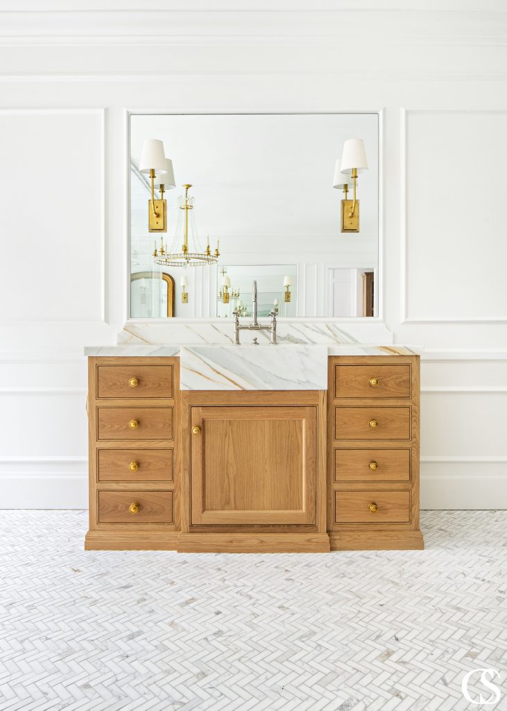 The many design ideas for this cabinet included a marble front sink extending from the countertop to really make a natural statement.