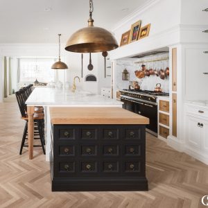 Beautiful custom black kitchen cabinets can have a powerful impact on your home. This unique kitchen island design combines multiple colors, materials, and global influence to reflect a beautifully eclectic style.