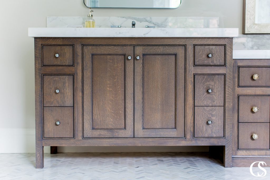 What does the best bathroom cabinet design look like to you? The beaded inset cabinets on this custom vanity frames each drawer and cabinet perfectly to add just enough subtle detail to let you know it was designed with an expert eye.