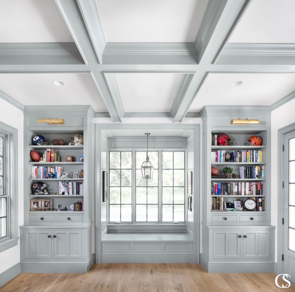 By reflecting the painted ceiling beams, this custom fireplace design looks 100% original to the home design. Which is exactly how custom cabinetry should look and feel.