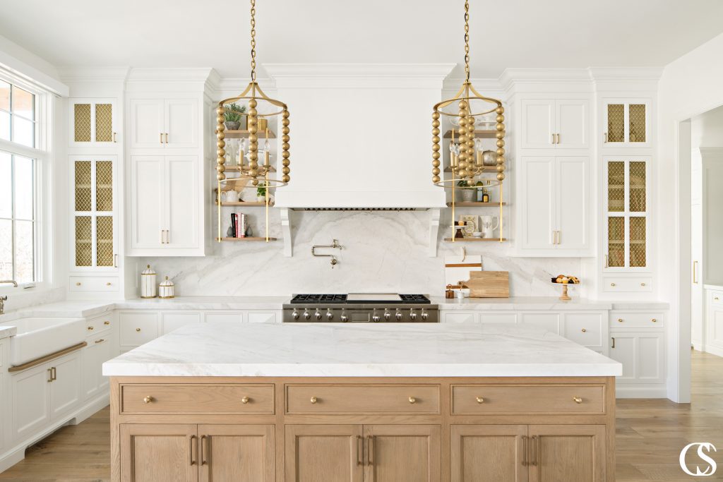 See how the wood island also uses beaded inset drawers and shaker cabinet doors to echo the look in the rest of the kitchen? It's those kind of consistencies that make the best cabinets for kitchen design a harmonious success.