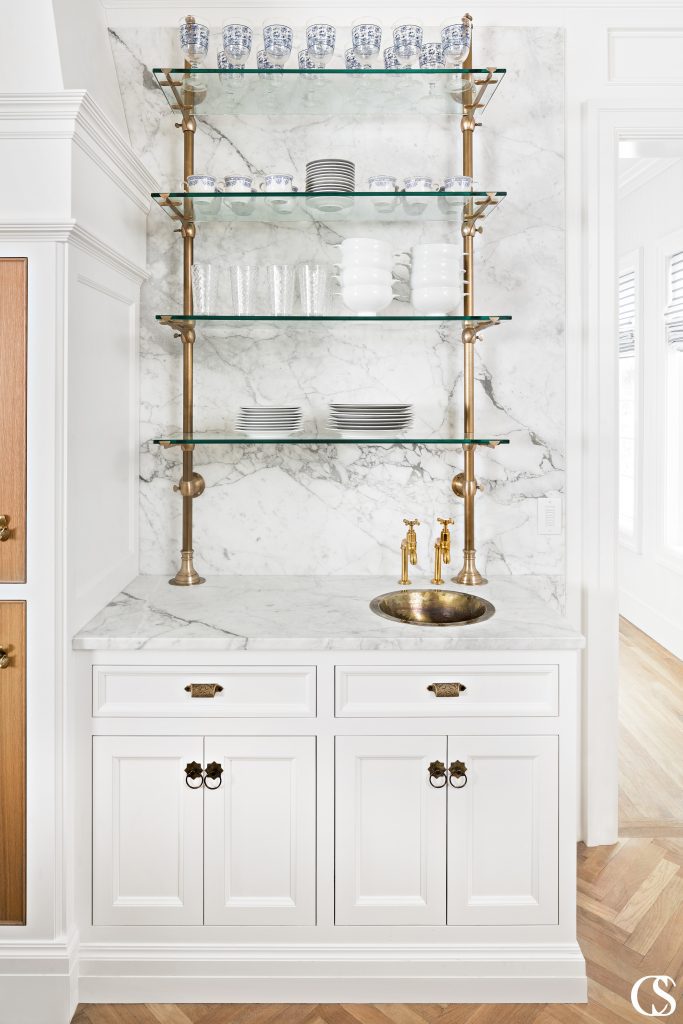 Glass and brass combine here to make a great bar space in this custom kitchen design.