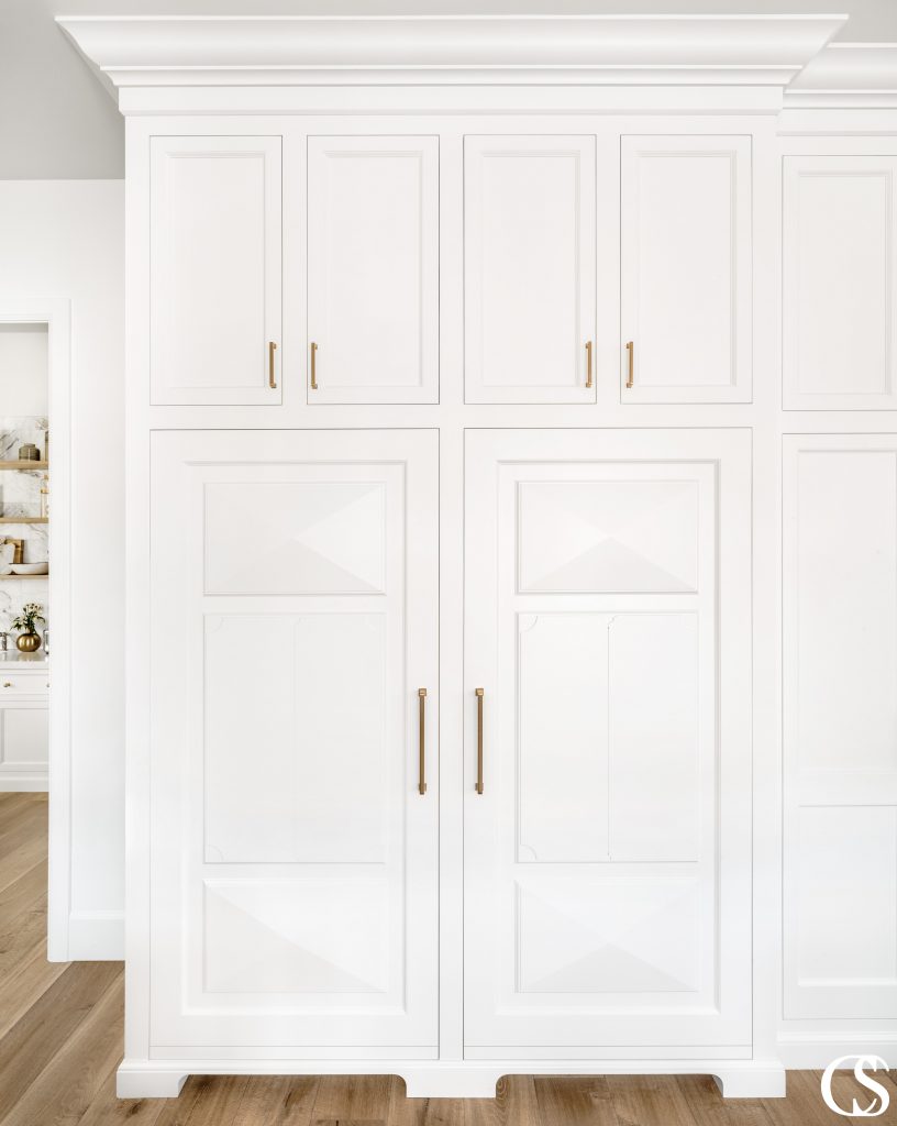 The structural detailing on these inset cabinet doors adds a little drama to some of the best custom cabinets for a kitchen. Details matter!