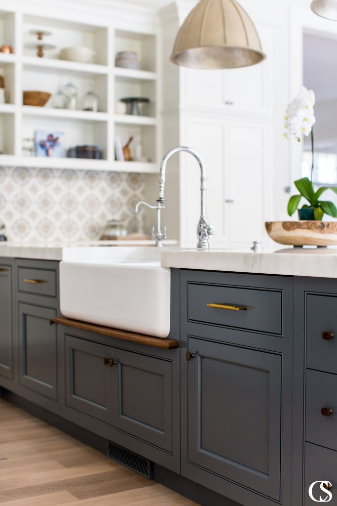 Blue custom cabinets in the kitchen don't have to be bright or overwhelming. I love the subtle, almost smokey blue of this kitchen island and how it grounds a mostly white kitchen.