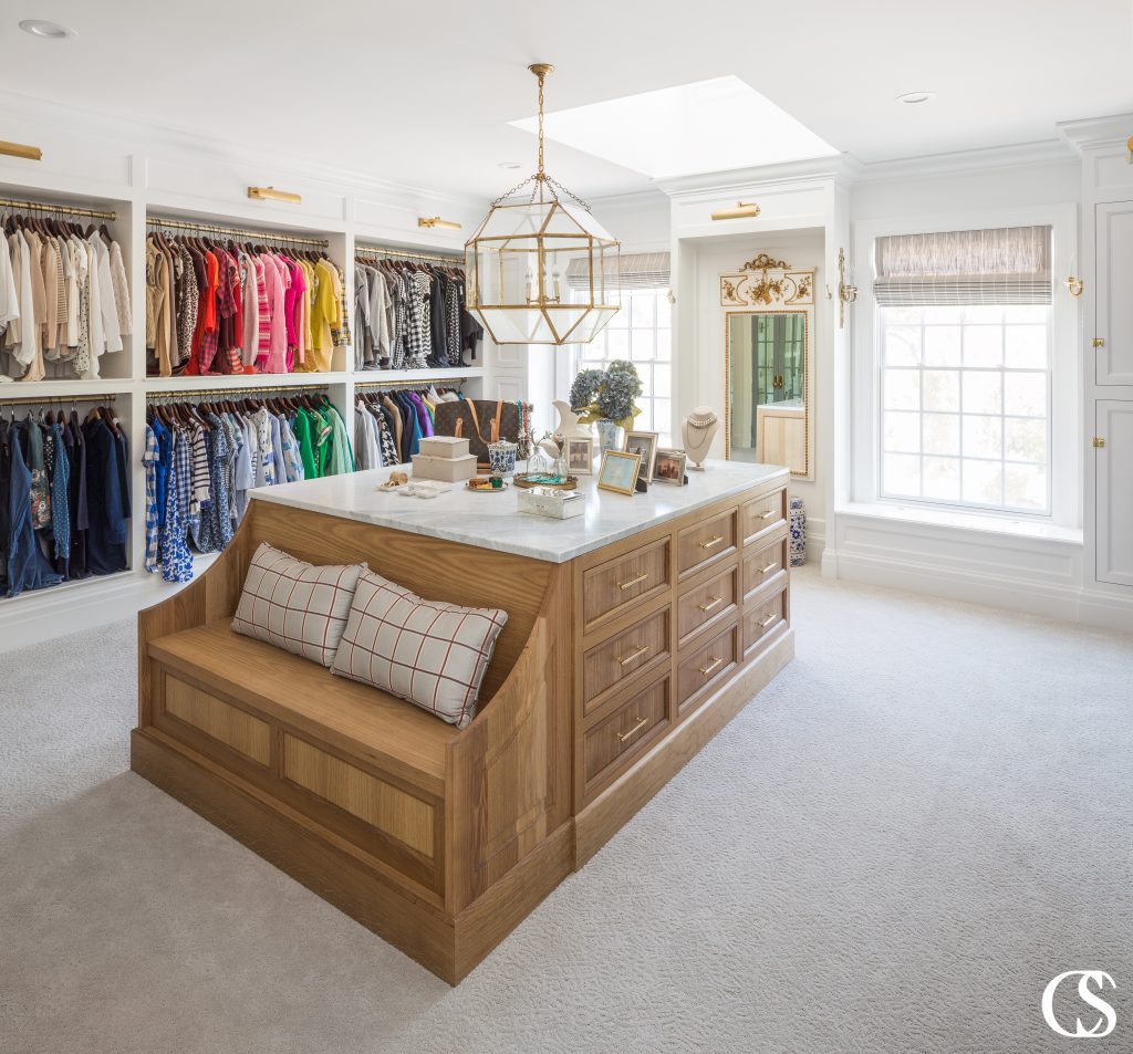 Don't forget the island full of drawers when coming up with built in closet ideas. You'll need space for delicates, jewelry, and even a comfy seat to put on shoes or just relax after a long day.