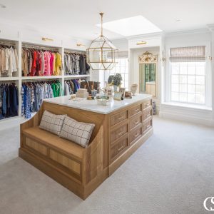 Don't forget the island full of drawers when coming up with built in closet ideas. You'll need space for delicates, jewelry, and even a comfy seat to put on shoes or just relax after a long day.