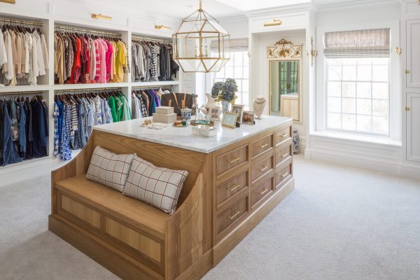 Don't forget the island full of drawers when coming up with built in closet ideas. You'll need space for delicates, jewelry, and even a comfy seat to put on shoes or just relax after a long day.