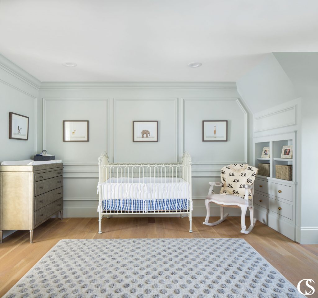 Every corner of this sweet nursery is enhanced by built in design. From decorative molding to built in cabinets and shelves, it all adds character and interest to the space.