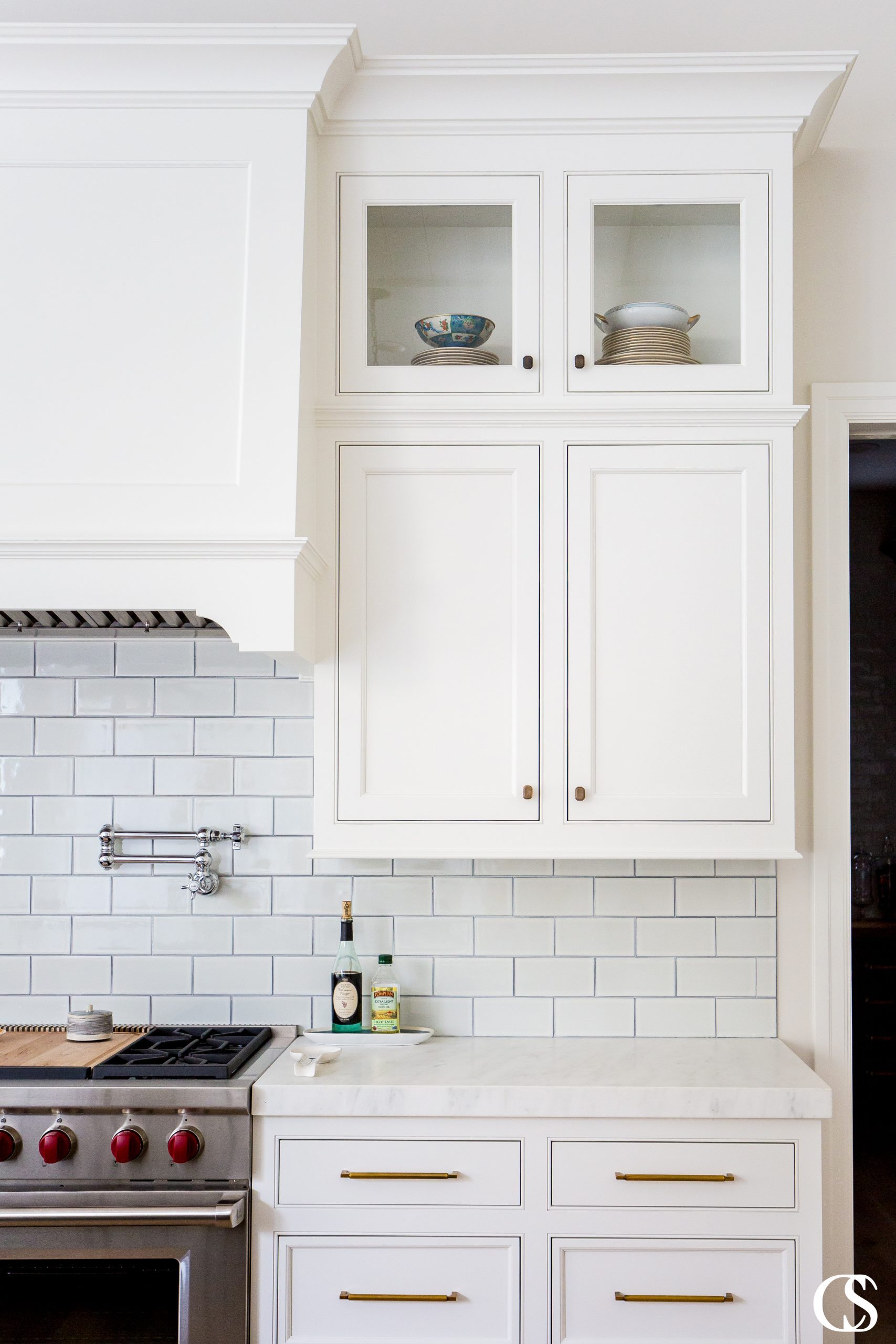 The cabinets for your kitchen should work hard but also provide a little joy—like being able to see your favorite dishes you bought abroad each time you enter the room.