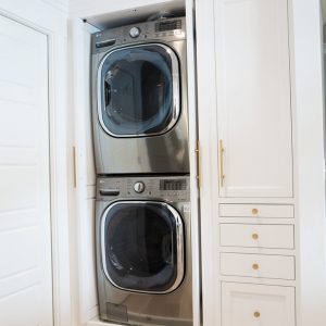 Who wouldn't want hideaway cabinets for their laundry? Especially if your washer and dryer don't have their own room!