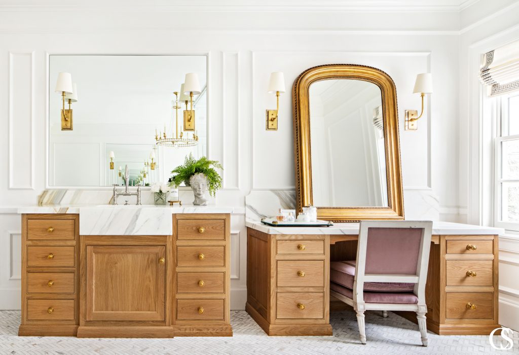 These custom bathroom cabinets feel luxurious stain color to marble countertops.