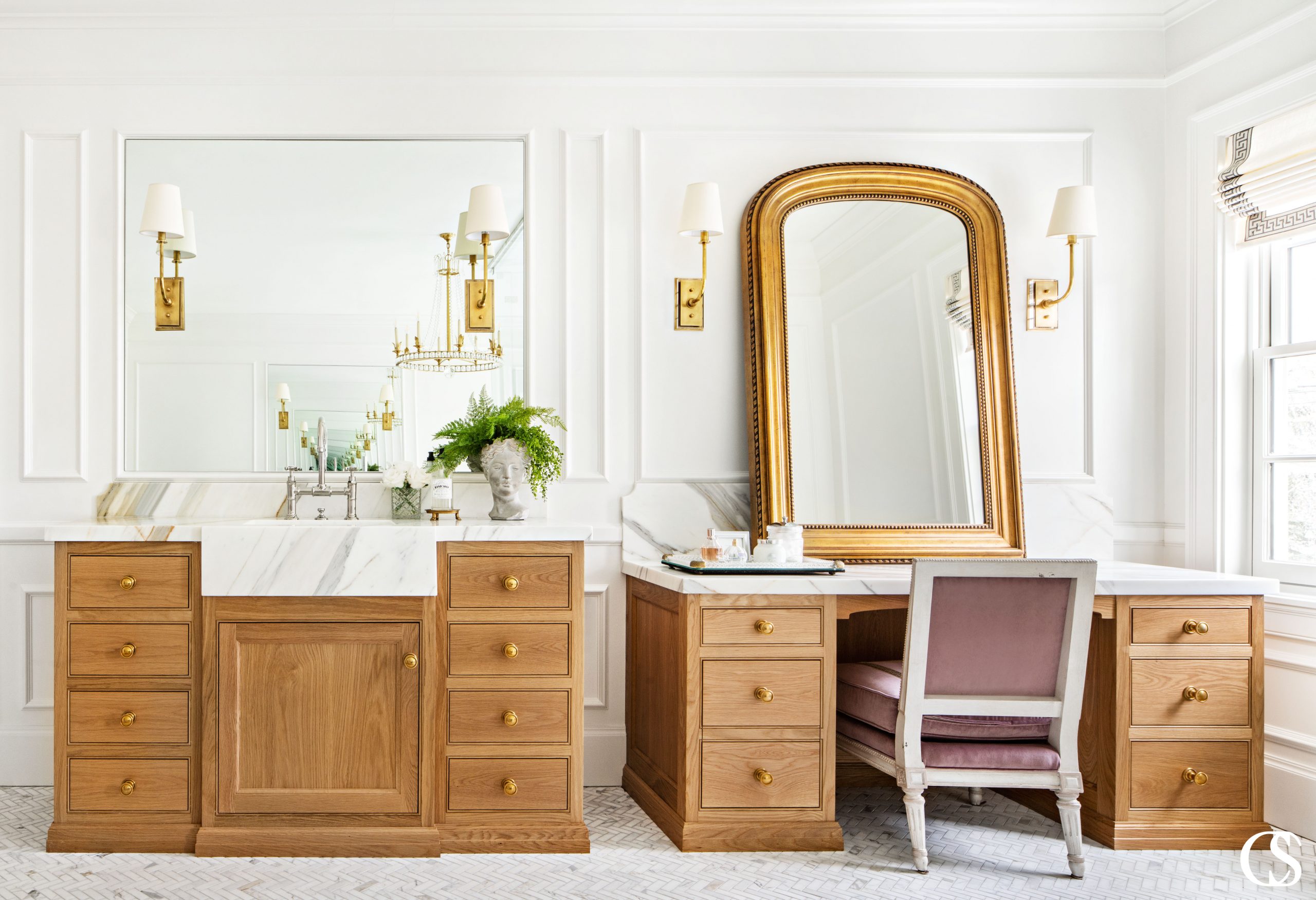 These custom bathroom cabinets feel luxurious stain color to marble countertops.