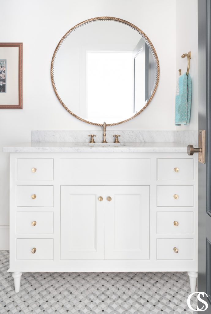 Custom bathroom cabinets designed with sleek lines and a modern aesthetic, featuring ample storage space and a glossy finish for a luxurious touch.