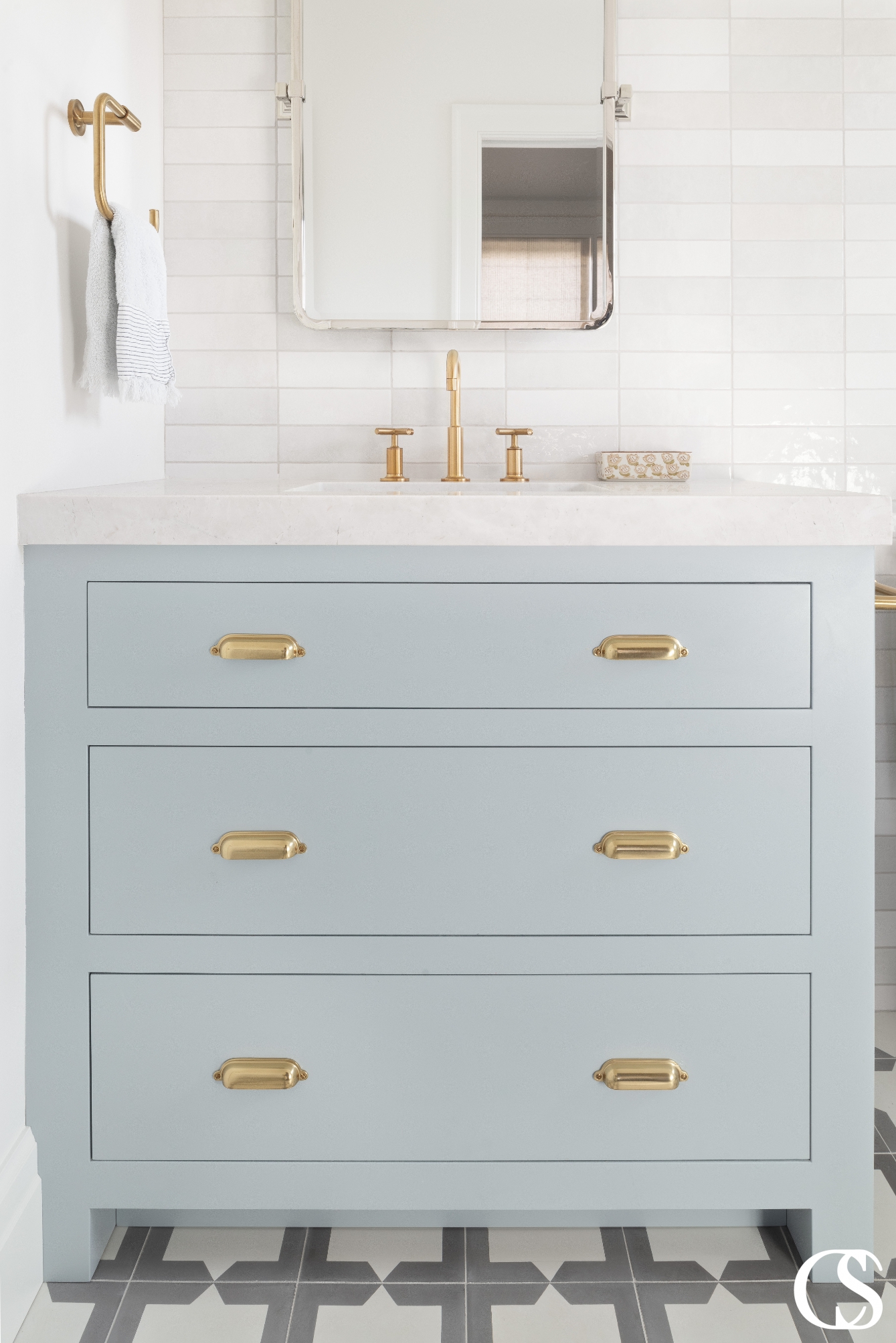 Elegant custom bathroom cabinets crafted from premium materials, including a marble countertop and intricate carvings on the doors and drawers.