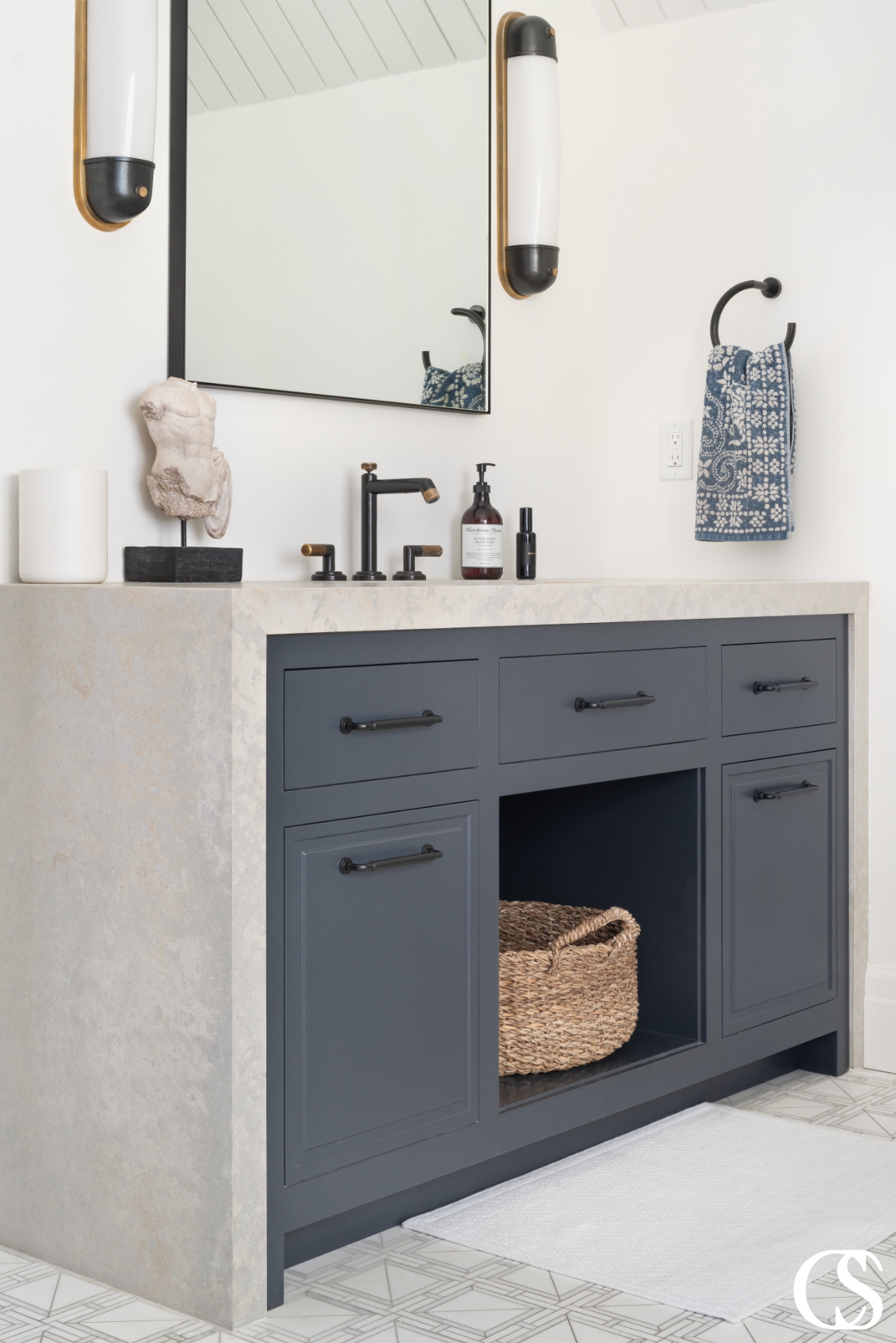 Functional and stylish custom bathroom cabinets, designed to maximize storage while fitting seamlessly into the overall design of the room. The cabinet features a mix of open shelving and closed storage options with a natural wood finish