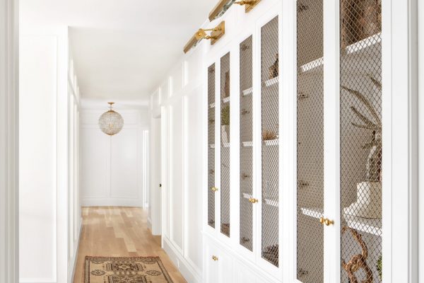 Make a hallway more than just bare walls and doorways with custom built in design like this! It's a beautiful way to create space and add character to a home.