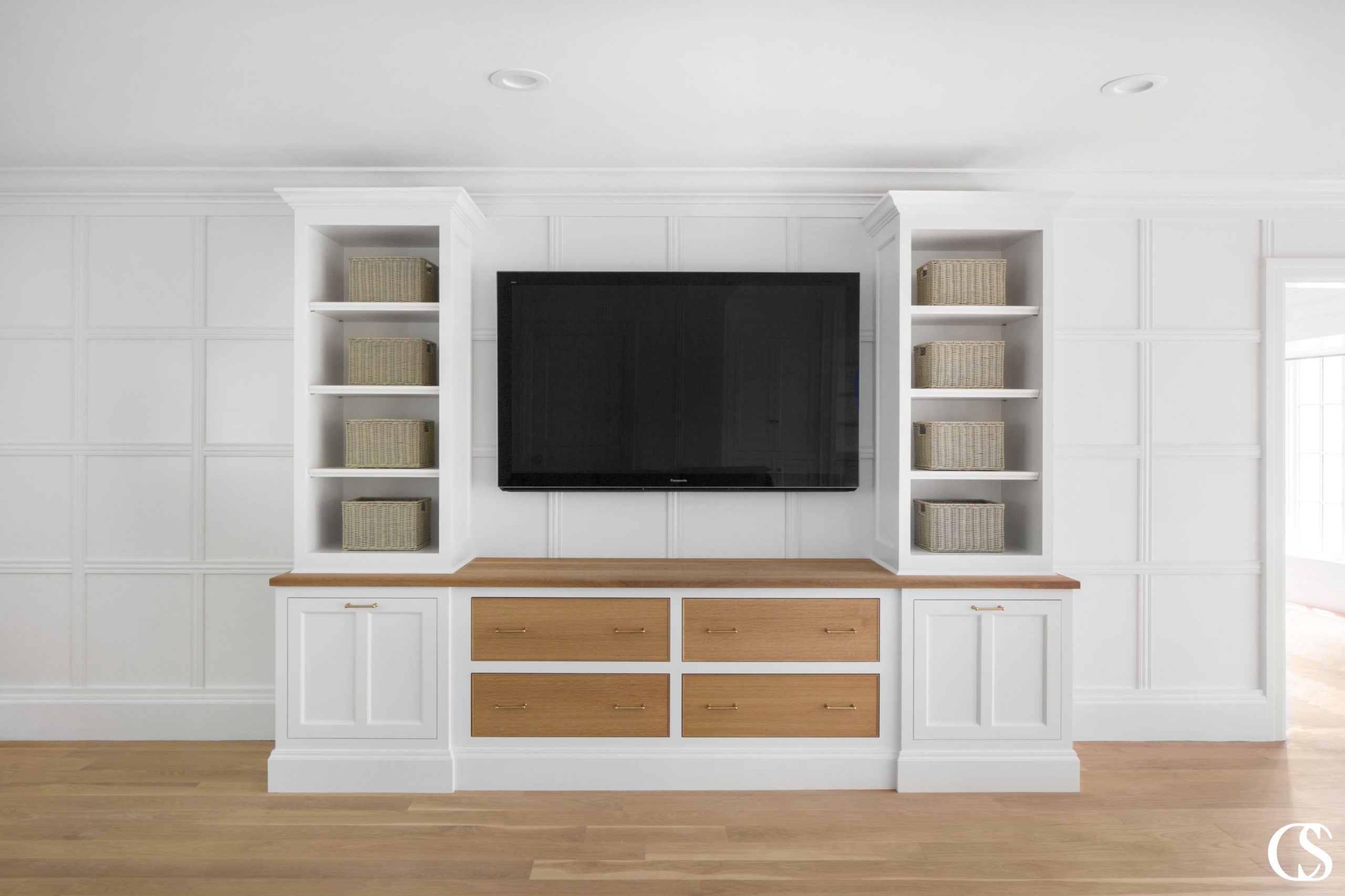 Open shelving is the perfect way to bring lightness to a big entertainment center, but it doesn't mean everything has to be on display. For more of our best custom built in design ideas, check out ChristopherScottCabinetry.com!