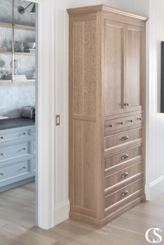 Elegant custom built-in cabinets crafted from high-quality materials, including a high quality hardware and intricate moldings on the doors and drawers.