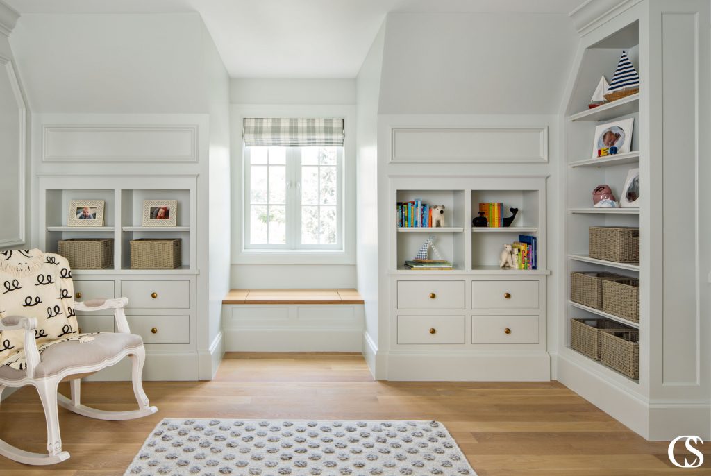 Commissioning custom cabinets for your home means fitting exactly what you need, where you want it. Like these custom nursery cabinets with their perfect tiny window seat for snuggling up and reading together.