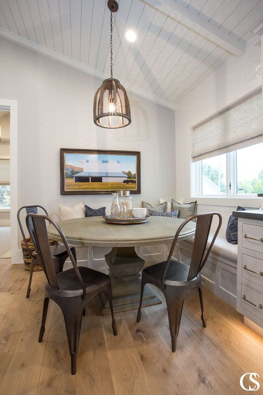 Why not add a cozy window seat to the custom cabinets for your kitchen? It adds such a homey feeling to the breakfast nook and adds some sneaky storage as well.