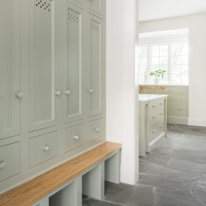 Having a custom entry way cabinet with a bench works for so many reasons—not least of why because it makes a great place to perch when removing shoes.