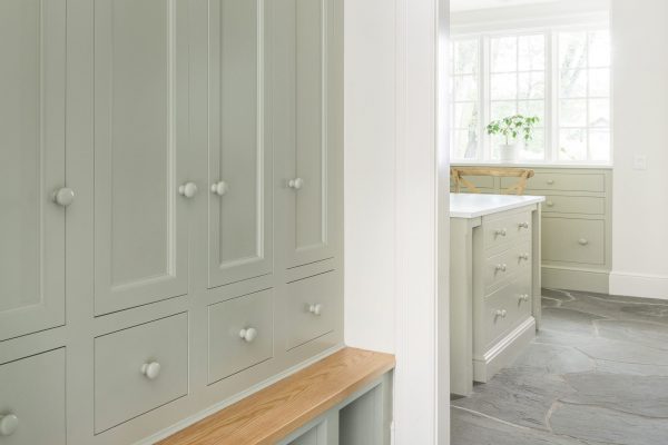 Having a custom entry way cabinet with a bench works for so many reasons—not least of why because it makes a great place to perch when removing shoes.