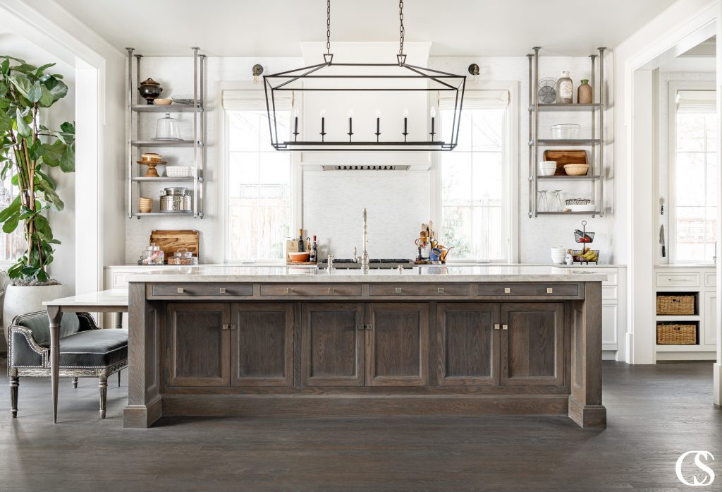 Don't waste usable space in your custom kitchen cabinet design! Check out those long drawers and handy cupboards utilizing every ounce of space in this custom kitchen island.
