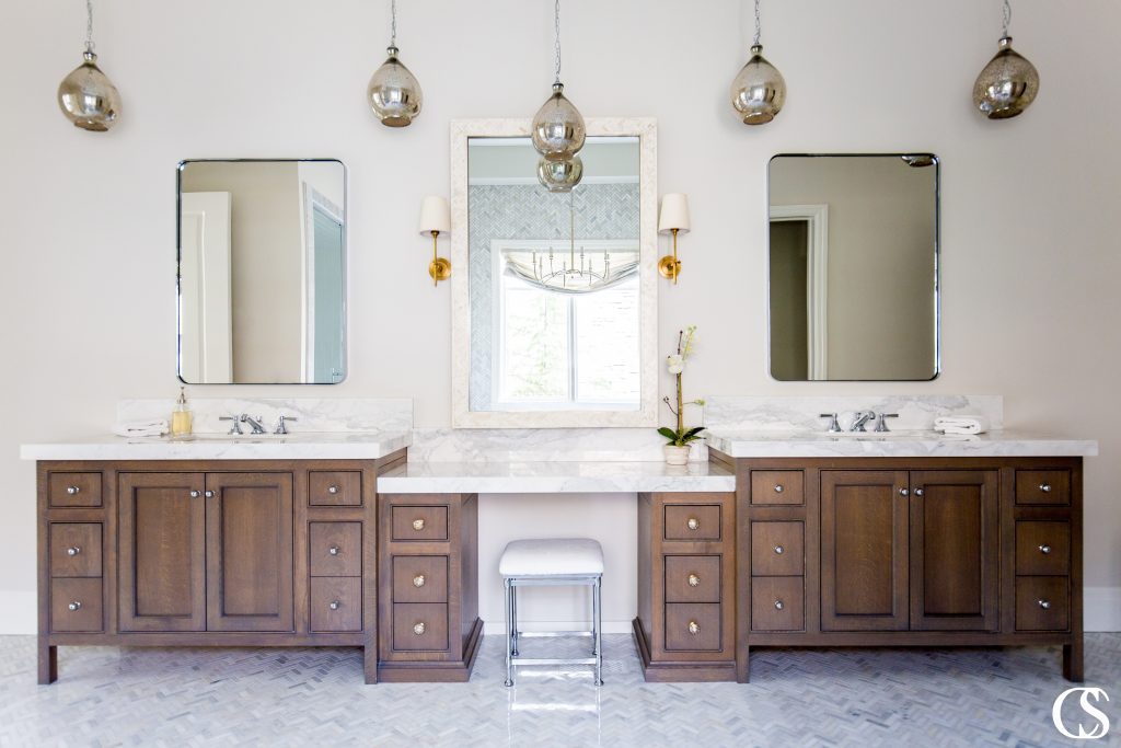 The custom two sink bathroom vanity is as modern a solution as it gets, but the unique bathroom design together evokes a dreamy vintage vibe.