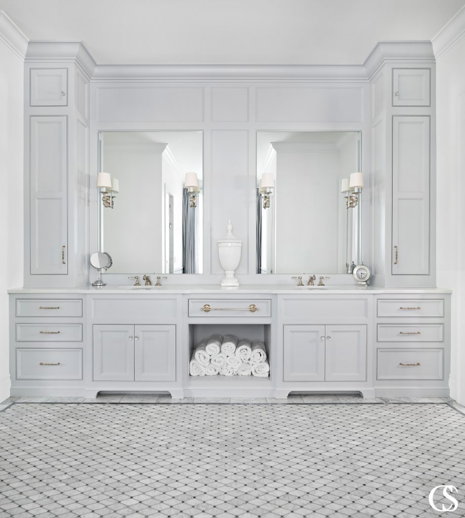 When a bathroom is meant to serve many, it's important to have two sinks and easily accessible towels like in this custom two sink bathroom design.