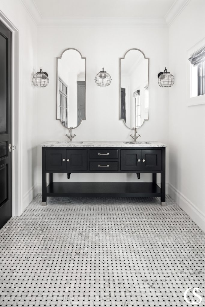Yet another completely distinct look, this modern black double vanity is part of a bathroom design that exudes class.