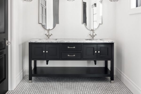 Don't sell your guest bathroom short! Even smaller spaces can accommodate custom two sink bathroom designs.