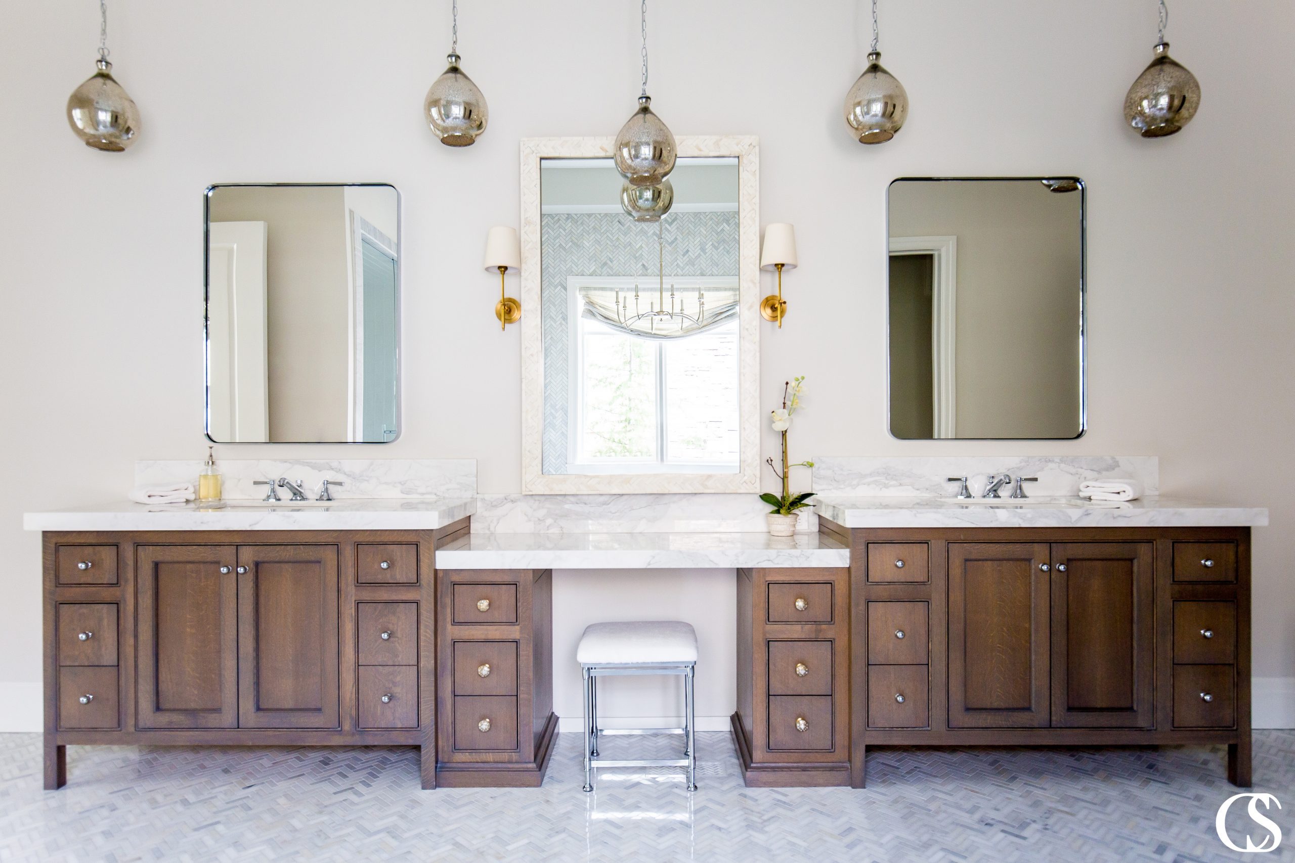 The custom two sink bathroom vanity is as modern a solution as it gets, but the unique bathroom design together evokes a dreamy vintage vibe.