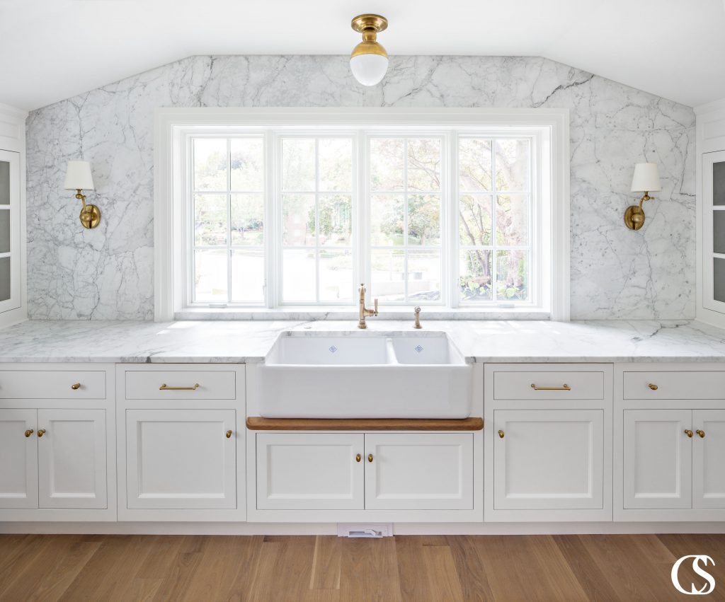 These custom white kitchen cabinets use beautiful inset drawers and doors. Inset cabinets create a traditional but timeless and high end look.