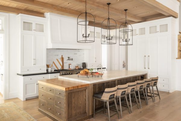 Pairing white with unique natural wood kitchen cabinets may be just the key to unlocking a perfectly homey, yet bright and open kitchen.