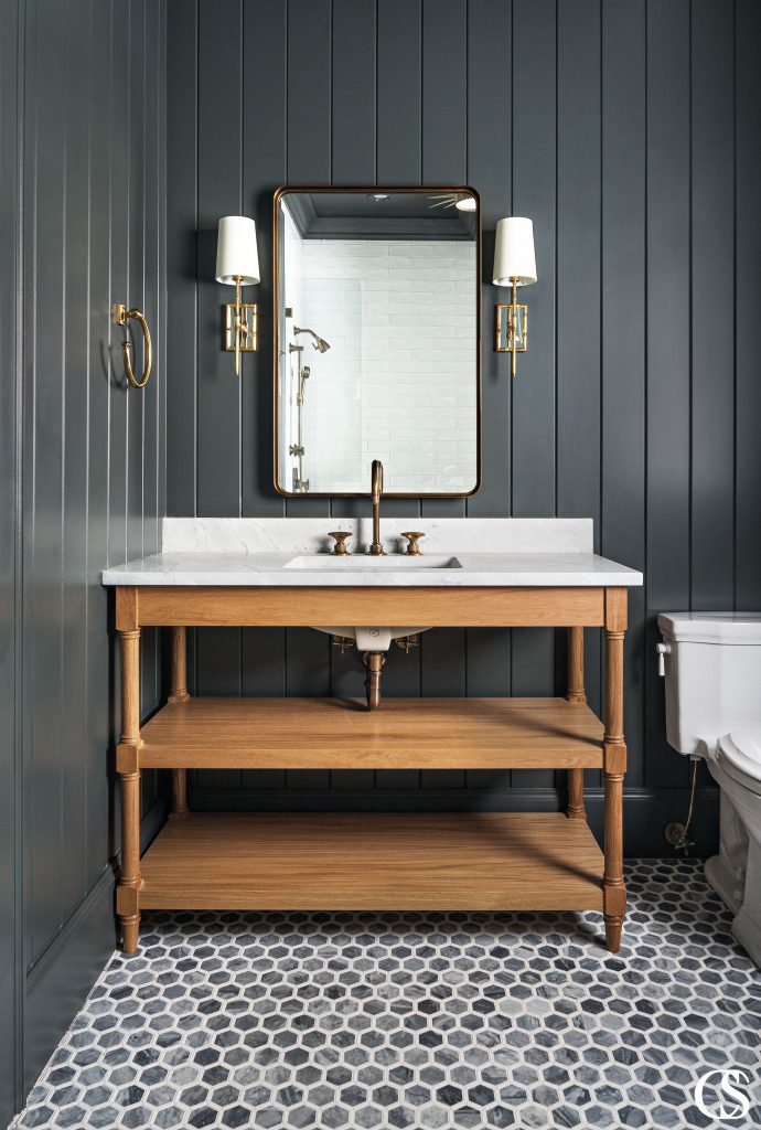 Vanity cabinets don’t have to be built-ins. Free-standing, open bathroom cabinets can have open shelving in lieu of closed cabinets. They also can feature furniture-style details.